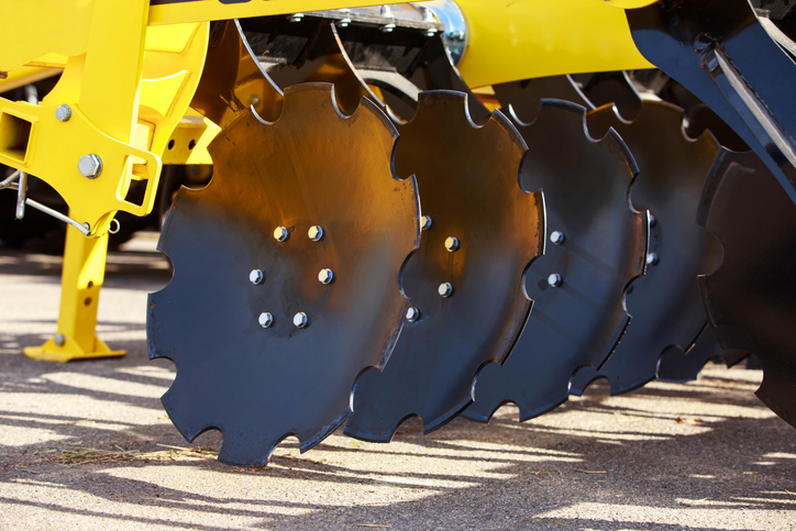 A closeup of precision metal stamping materials in agricultural equipment