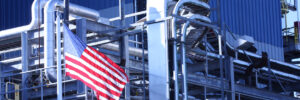 American flag at factory. Reshoring in metal stamping